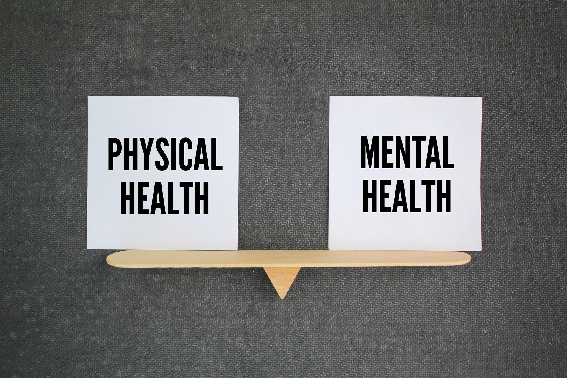 balance between the words Physical Health vs Mental Health. Maintaining good physical health requires regular exercise, a balanced diet, sufficient sleep, and effective stress management